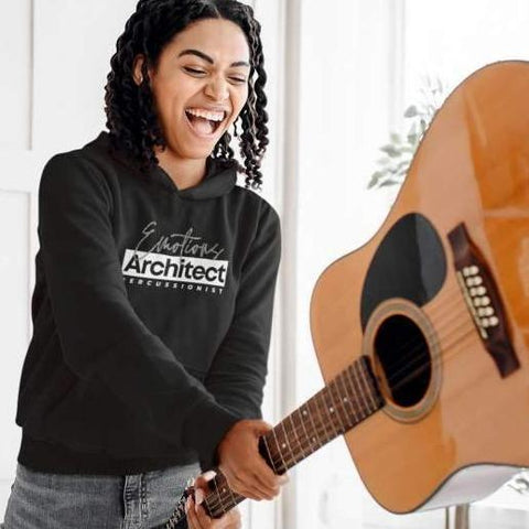 Percussionist Hoodie for Musicians - Smiling woman holding an acoustic guitar pretending to throw it to the ground
